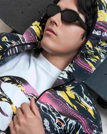 Person wearing a colorful jacket with a brand logo